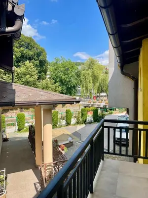 a balcony of a building with a view of a street at Apartmani Centar Fojnica in Fojnica