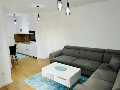 a living room with a couch and a table at LookView apartment in Bihać
