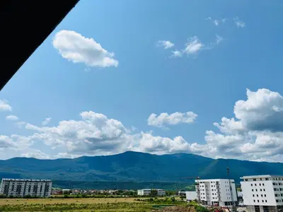 a view of a city with buildings and mountains at LookView apartment in Bihać