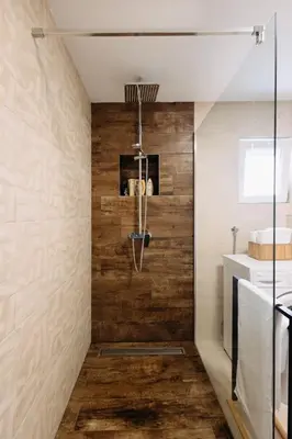 a bathroom with wood paneling and a shower at BDD House in Banja Luka