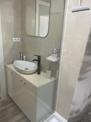 a bathroom with a sink and a mirror at Vidovdanska house in Šipovo