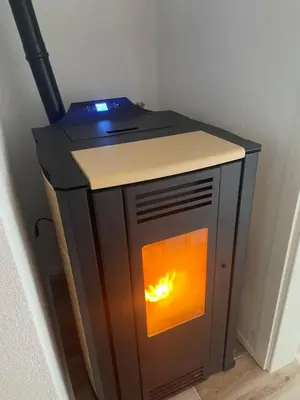 a wooden stove with a fire inside of it at Vidovdanska house in Šipovo