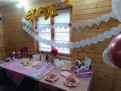 a table in a room with a table set for a party at Brvnara Gold Hill in Prijedor
