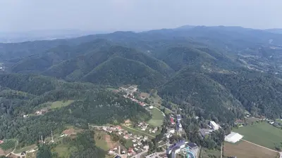 an aerial view of a mountain valley with trees at Vila Mir in Banja Vrućica