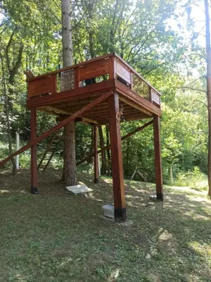 a tree house built around a tree at Retro Retreat Izačić in Bihać