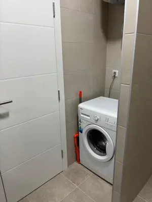 a washer and dryer in a small room at HeraLux in Doboj