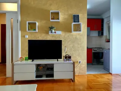 a living room with a flat screen tv on a dresser at Apt Iva 2 in Banja Luka
