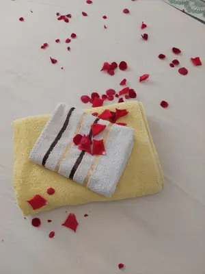 a couple of towels with hearts on a table at Apt Iva 2 in Banja Luka