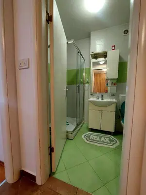 a bathroom with a glass shower and a sink at Apt Iva 2 in Banja Luka