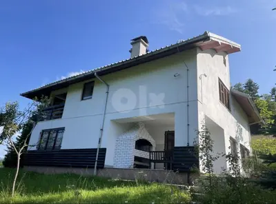 a large white house with a porch and stairs at Vila Ponijeri in Kakanj