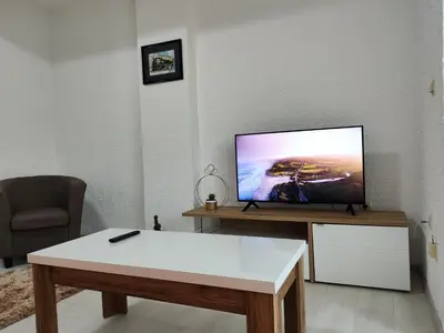 a living room with a flat screen tv on a table at Vista in Živinice