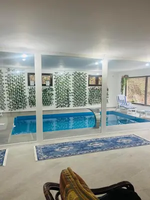 a large swimming pool in a house at Villa Casa de Dina in Bihać