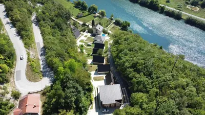 an aerial view of a house next to a river at Villa Casa de Dina in Bihać