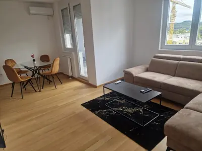 a living room with a couch and a table at Apartman Giro in Banja Luka