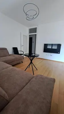 a living room with a couch and a table at Apartman Giro in Banja Luka