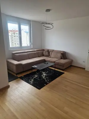 a living room with a couch and a table at Apartman Giro in Banja Luka