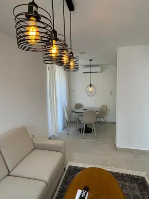 a living room with a couch and a table at Apartmani Bare in Jajce