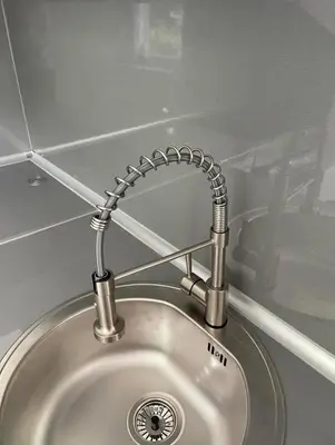a kitchen sink with a metal faucet above it at Apartman Magi in Jajce