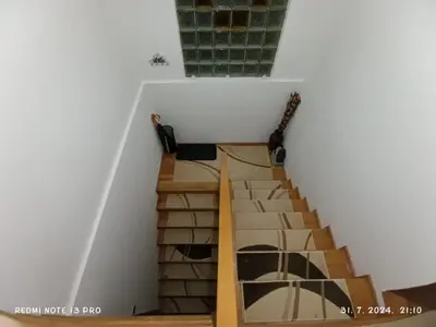 a staircase in a house with two guitars at Apartment Happy Corner in Visoko