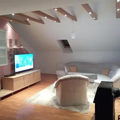 a living room with a couch and a tv at Petra in Livno