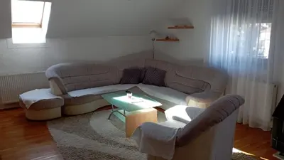 a living room with a couch and a table at Petra in Livno
