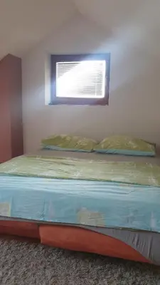 a bed in a room with a window at Petra in Livno
