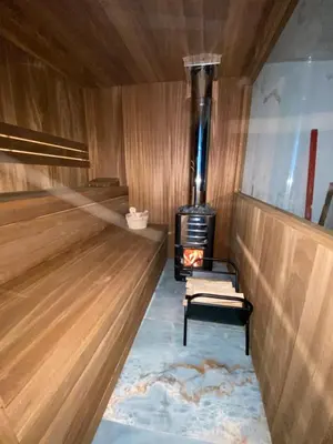 a room with a woodburning stove in a boat at BellaVista Prokosko Jezero in Paljike