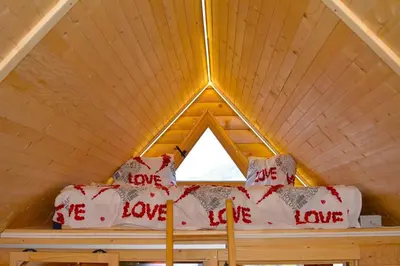 a bed in a room with a window at BellaVista Srce Prokosko Jezero in Fojnica