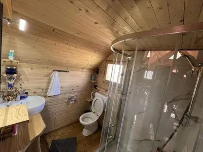 a bathroom with a toilet and a sink and a shower at BellaVista Srce Prokosko Jezero in Fojnica
