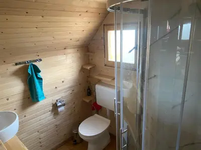 a small bathroom with a toilet and a shower at BellaVista Srce Prokosko Jezero in Fojnica