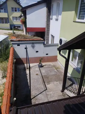 a balcony with a gate and a building at Apartment Miki in Visoko