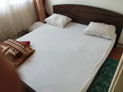 a bed with two pillows on it in a room at Apartment Miki in Visoko