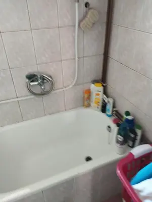 a bathroom with a shower with a white tub at Apartment Miki in Visoko