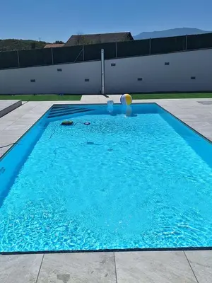 a large blue swimming pool with a ball in it at Vila Pascha in Zlopoljac