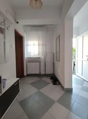 an empty room with a radiator and a tile floor at Prenoćiste Borik in Sanski most