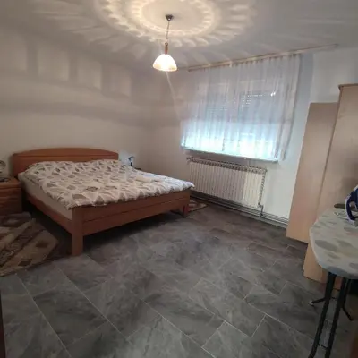 a bedroom with a bed and a window at Prenoćiste Borik in Sanski most