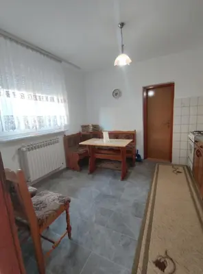 a room with a table and chairs in a room at Prenoćiste Borik in Sanski most