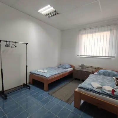 a room with two beds in a room at Prenoćište BORIK in Sanski most