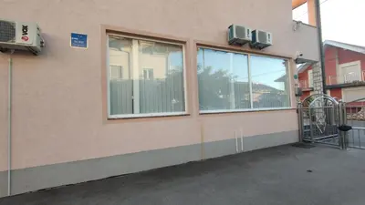 a building with windows on the side of it at Prenoćište BORIK in Sanski most