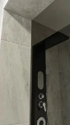 a shower in a bathroom with a shower at Apartments Bioland in Kulen Vakuf
