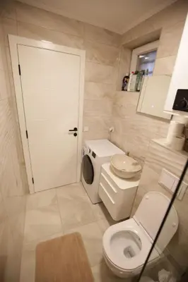a small bathroom with a toilet and a sink at Apartman Centar in Fojnica
