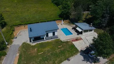 an aerial view of a house with a swimming pool at Holiday Home Silenzio in Bihać