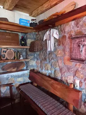 a stone wall with a bench in a room at Kuća za odmor Vidikovac in Rumboci