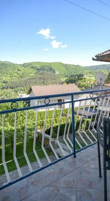 a balcony with a view of the mountains at Apartman ATLAS in Jajce