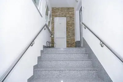a staircase leading up to a door in a building at Apartman ATLAS in Jajce