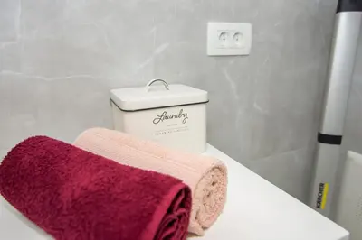 a bathroom with two towels sitting on a sink at Villa Lea in Bihać