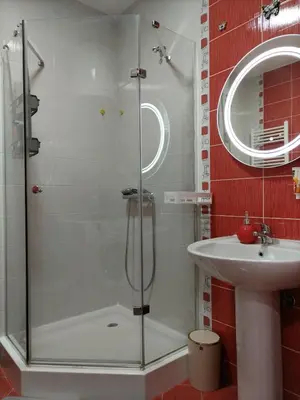a bathroom with a shower and a sink at Apartman Atina Doboj in Doboj