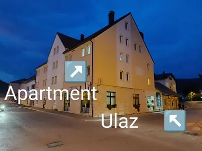 a building with the words apartment ukja on it at Apartman Mia Kupres in Kupres