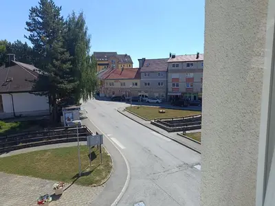 a view of a street in a town with buildings at Apartman Mia Kupres in Kupres