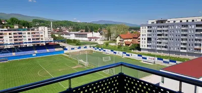 an aerial view of a soccer field in a city at Exclusive Kiseljak apartman in Kiseljak